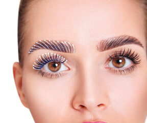Female eyes with arrows on eyelashes.