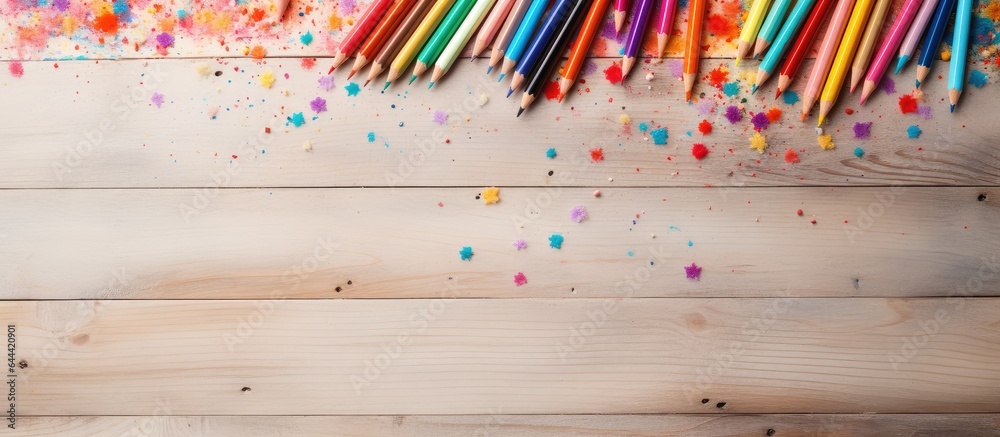 Aufkleber Selective focus on multi colored pencils and particle on a isolated pastel background Copy space