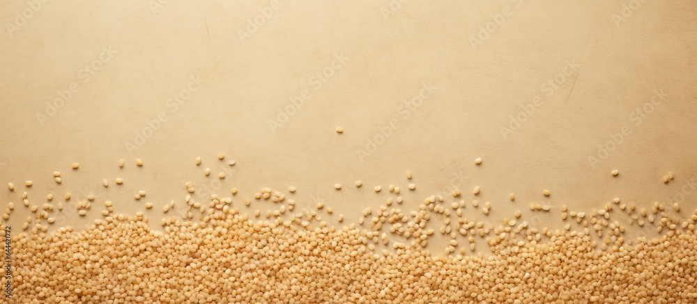 Poster raw bulgur seeds seen from above on a isolated pastel background copy space