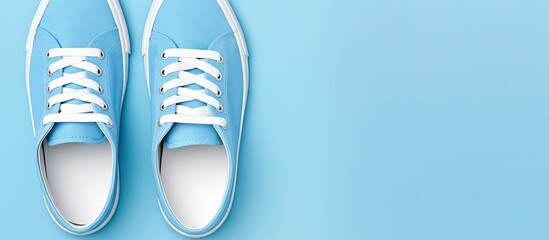 Sport shoes in blue for all ages on a isolated pastel background Copy space