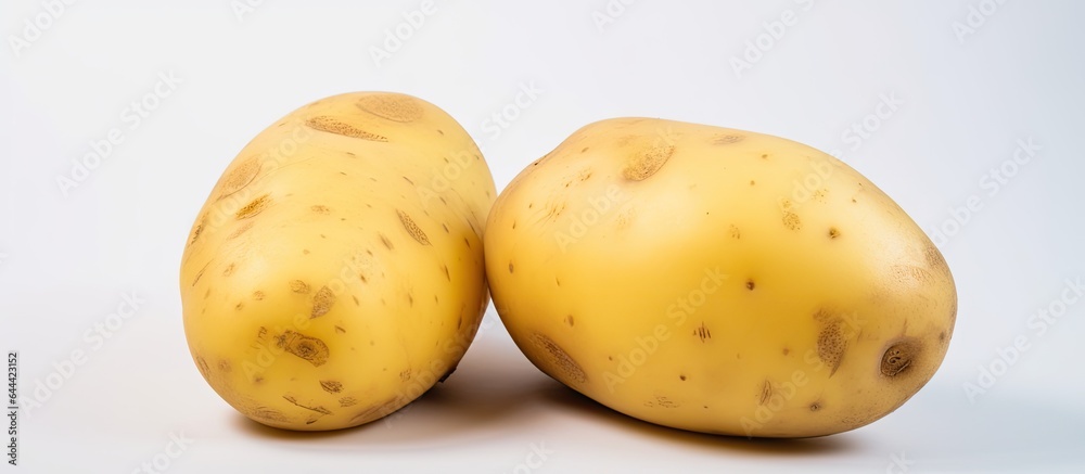 Poster Yellow potatoes with a shape are sorted on a isolated pastel background Copy space