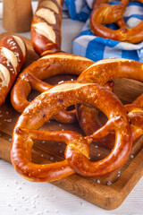  Homemade bavarian pretzels on kitchen table, traditional Oktoberfest, bavarian, German  breakfast bun pastry 