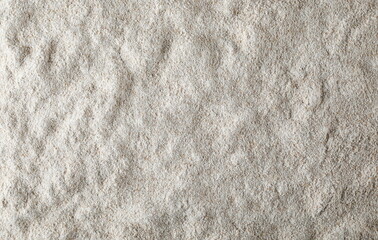 Pile of integral barley flour background and texture, top view 