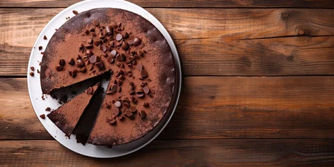 Keuken spatwand met foto Sweet temptation. Dark chocolate cake on wooden table. Delightfully sinful. Closeup of gourmet dessert. Homemade cocoa © Bussakon