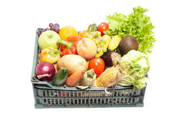Fresh ripe vegetables and fruits in crate isolated on white background