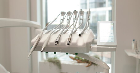 Tools and equipment for dental treatment in a dental clinic. Close-up of the dentist's workplace.