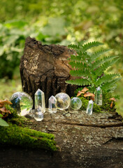 set of Crystal minerals in forest, abstract natural background. clear quartz gemstones for Magic Crystal Ritual, Witchcraft. spiritual esoteric practice for relax, harmony. healing stone therapy