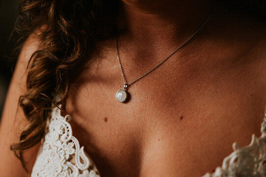 close up of a person wearing a necklace