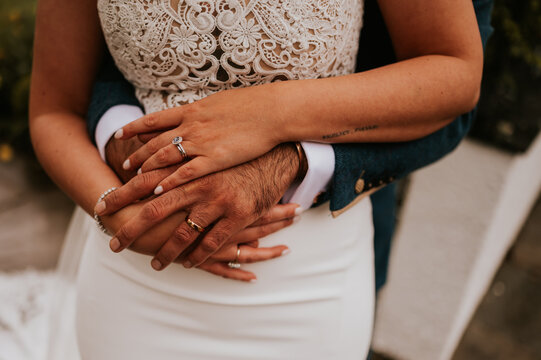 hands of the groom and bride
