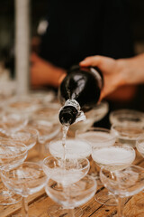 pouring champagne into glass