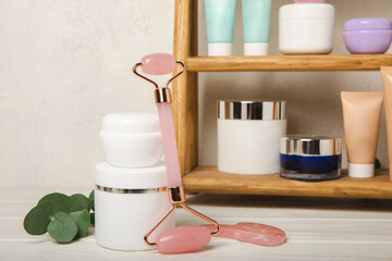 Skin care stage for healthy skin - face serum and lotion, scrub, peeling and cleanser on white wooden background. The concept of beauty and cosmetics. A set of cosmetics on a wooden shelf. 