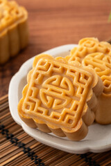 Delicious Cantonese moon cake for Mid-Autumn Festival food mooncake on wooden table background.