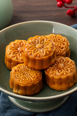 Delicious Cantonese moon cake for Mid-Autumn Festival food mooncake on wooden table background.