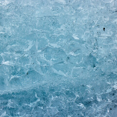 Abstract structure of a blue transparent block of ice. Graphic, monochrome background.