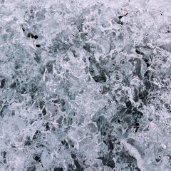 Abstract structure of a transparent block of ice. Graphic, monochrome background.