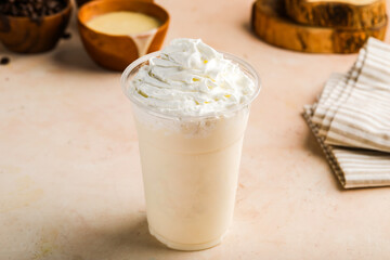 Vanilla Milkshake with cream served in glass isolated on table top view healthy morning drink