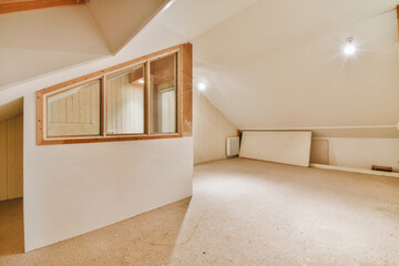 Spacious mansard empty room
