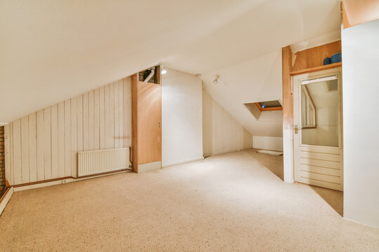 Spacious mansard empty room