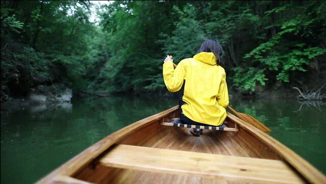 Paddling canoe in the rainforest