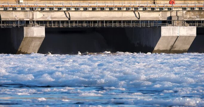 4K - A stream of water falling from a hydroelectric dam