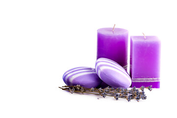 Obraz na płótnie Canvas Soap and aromatic candles with lavender extract isolated on white background. Free space for text.
