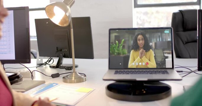 African american businesswoman on video call on laptop screen