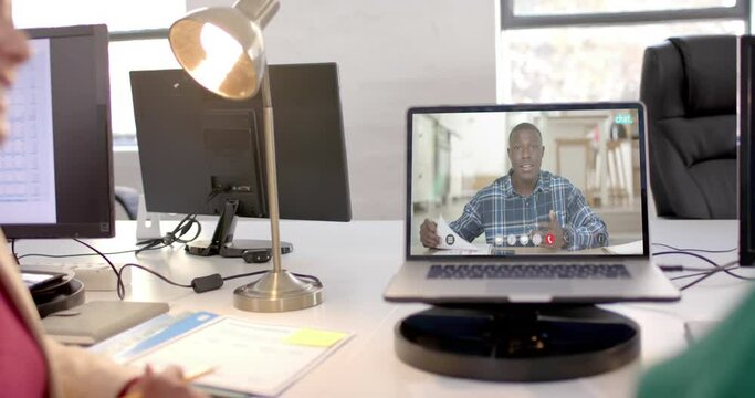 African american businessman on video call on laptop screen