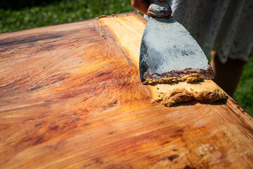 Removing old paint using a solvent and a trowel, renovation of wood surface