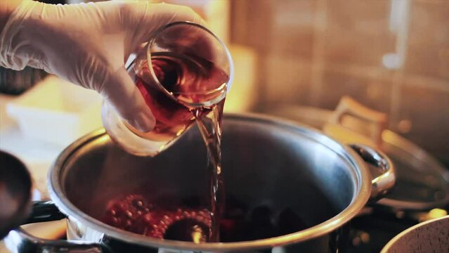 beets boiling in the pot and bulgur in the pot next to it