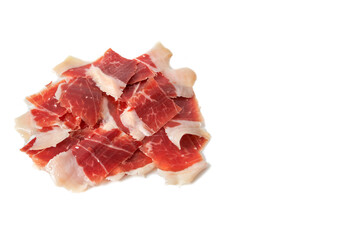 Sliced Iberian Serrano ham isolated on white background. Iberian serrano ham is a Spanish delicacy,famous for its smoky flavor and tender, salty texture, the richness of the Iberian culinary tradition
