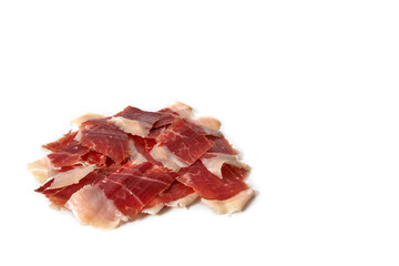 Sliced Iberian Serrano ham isolated on white background. Iberian serrano ham is a Spanish...
