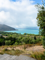 Fototapeta premium view of shore of Lake Sevan near Sevan peninsula on summer day, Armenia