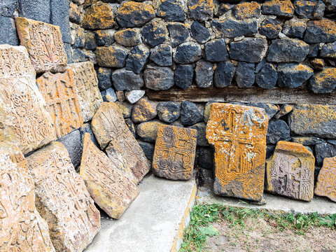 Khachkars along walls of shurch in Sevanavank Sevan Monastery, Armenia