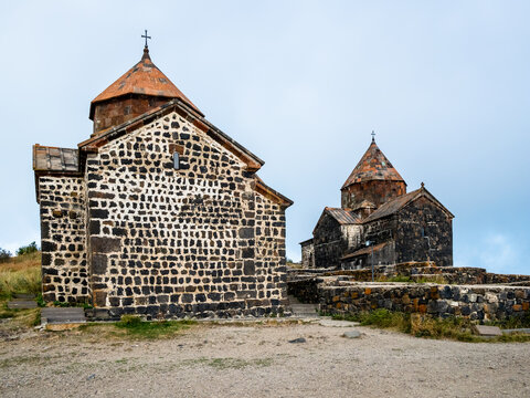 Surp arakelots and Surp Astvatsatsin churches of Sevanavank Sevan Monastery on overcast summer day, Armenia