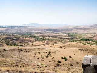 view of Armenian wasteland from Arch of Charents, located in village of Voghaberd, Kotayk region, on Yerevan - Garni road on sunny summer day