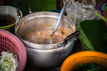 Grated fish is put in a pot for seasoning and then made into wraps for sale in Ban Na Kluea Market, Pattaya, Thailand, 4 September 2023.