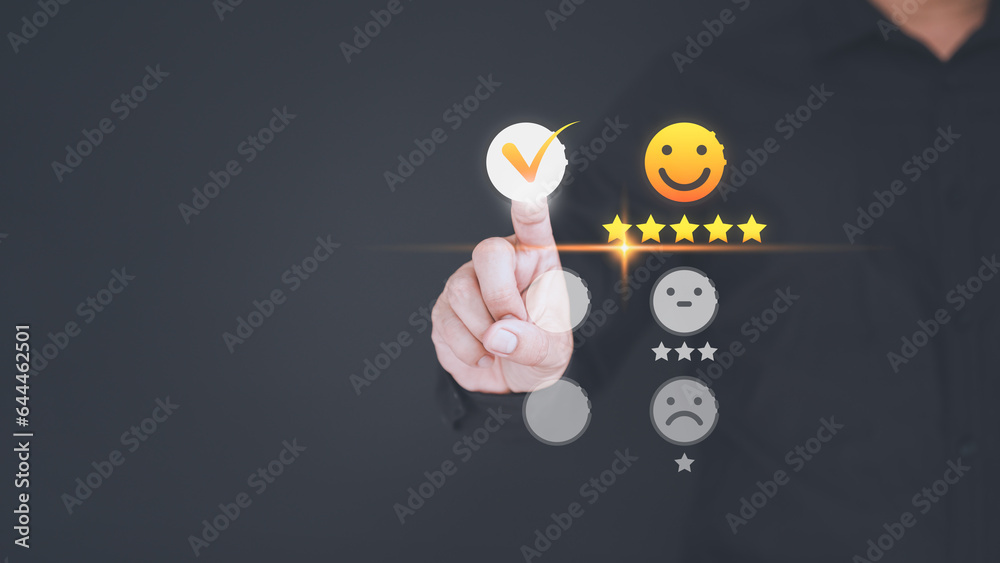 Poster user hand touching the virtual screen on happy smile face icon to give satisfaction in service. onli