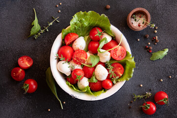 Caprese salad with mozzarella cheese and tomatoes of Italian cuisine - Powered by Adobe