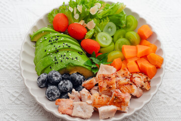 Healthy grilled chicken salad on white background