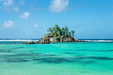 Ile Souris and turquoise water, a scenic islet near Fairytale beach in Mahé island, Seychelles