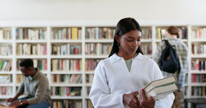 Woman, books and student in library with education, learning and knowledge, research and scholarship. University campus in India, academic growth and development, bookshelf and school information