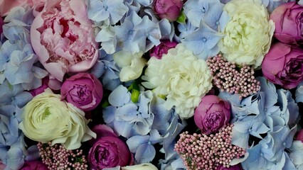 Floral natural background with blue gardenia, pink rose, white chrysanthemum close-up