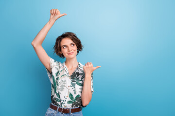 Photo portrait of pretty young girl look pointing empty space wear trendy print leaves outfit...