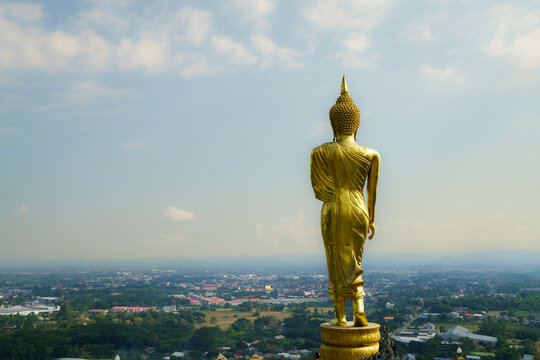 The back of the standing Buddha image enshrined at Wat Phra That Khao Noi in Nan Province, which is considered a famous tourist attraction that tourists must come to take pictures and worship.