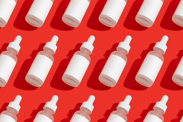 Blank white cosmetic dropper on red background. Christmas Valentines day sale concept