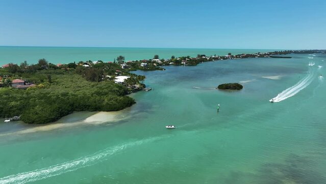 Aerial view of a motorboat sailing along Lyons Bay in Casey Key, Florida, United States.