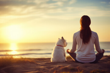 A woman with mental health problems sitting near the sea at dawn with her dog beside her, doing meditation as a tool to support her illness, copy space