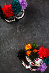 Day of the dead, Dia De Los Muertos, Halloween celebration background with sugar skull masks on stone table. Mexican culture holiday concept.