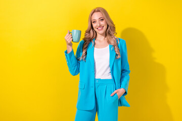 Portrait of nice gorgeous lady toothy smile arm hold fresh coffee cup isolated on yellow color background