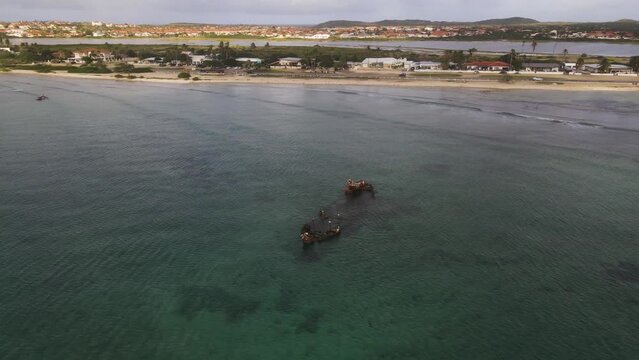Aerial view of Baboo Shipwreck along the Arashi Beach at sunset, Noord, Aruba.